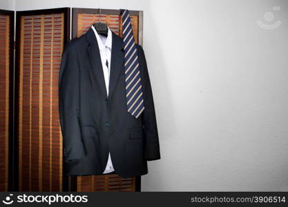 suit hanging on hangers