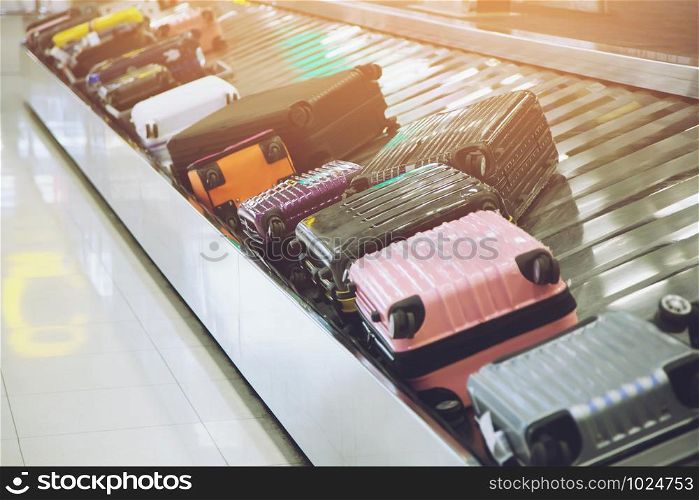 Suitcase or luggage with Circulating conveyor belt in the baggage claim in the international airport.