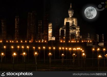Sukhothai Co Lamplighter Loy Kratong Festival at The Sukhothai Historical Park covers the ruins of Sukhothai, in what is now Northern Thailand. With full moon