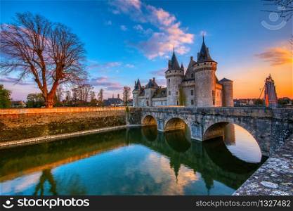 Sully Sur Loire, France - April 13, 2019: Famous medieval castle Sully sur Loire at sunset, Loire valley, France. The chateau of Sully sur Loire dates from the end of the 14th century.