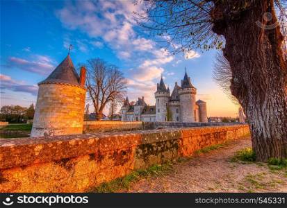 Sully Sur Loire, France - April 13, 2019: Famous medieval castle Sully sur Loire at sunset, Loire valley, France. The chateau dates from the end of the 14th century.