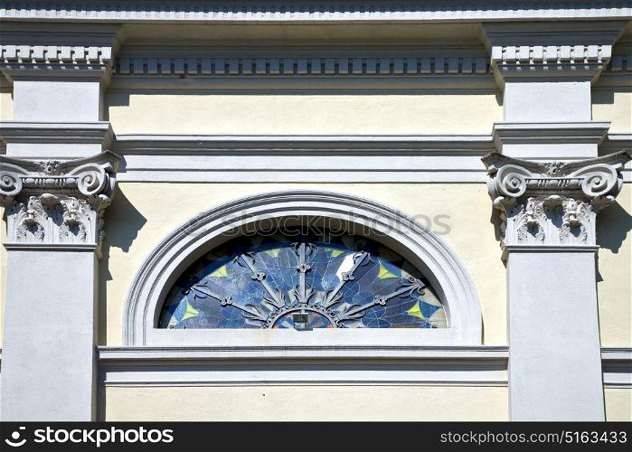 sumirago cross church varese italy the old rose window and mosaic wall in the sky sunny day