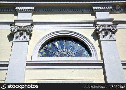 sumirago cross church varese italy the old rose window and mosaic wall in the sky sunny day