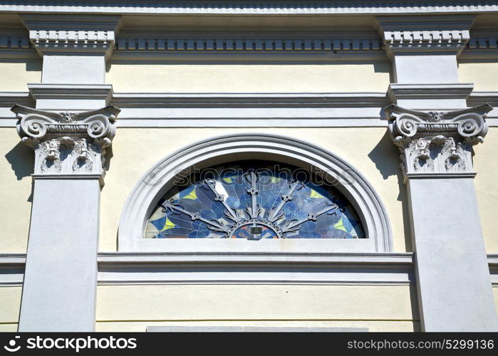 sumirago cross church varese italy the old rose window and mosaic wall in the sky sunny day