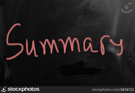 ""Summary" handwritten with white chalk on a blackboard"