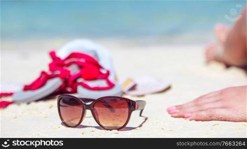Summer accessories - sunglasses, white beach and tropical view