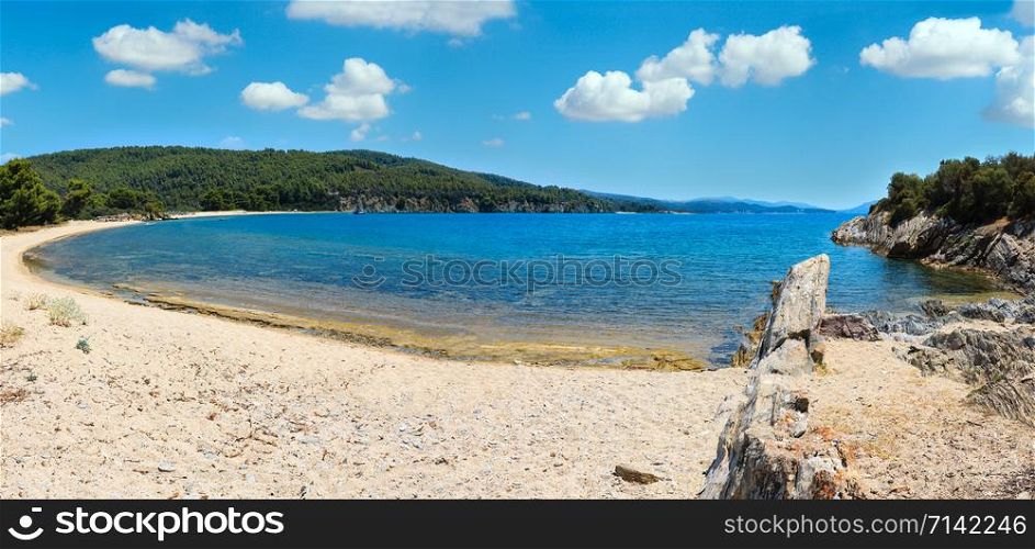 Summer Aegean Sea coast landscape with sandy beach, Sithonia, Halkidiki, Greece. People are unrecognizable. Multi shots stitch panorama.