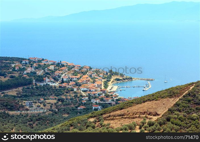 Summer Aegean sea coast top view. The Pyrgadikia village on shore (Sithonia, Halkidiki, Greece).