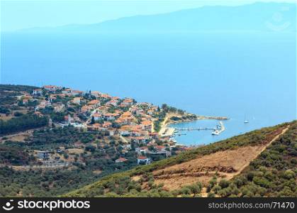 Summer Aegean sea coast top view. The Pyrgadikia village on shore (Sithonia, Halkidiki, Greece).