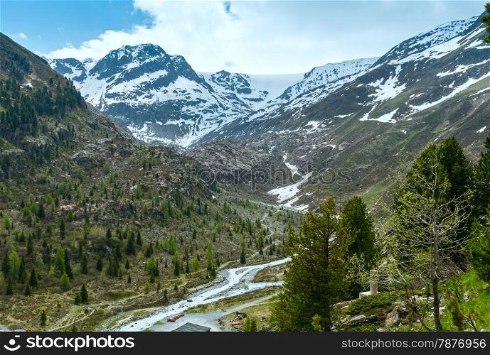 Summer Alps mountain landscape with snow on slope (Austria).