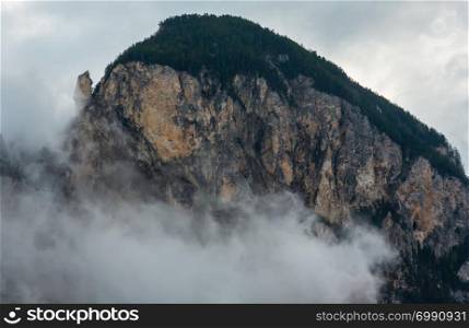 Summer Alps mountain rock overcast cloudy view, Switzerland.