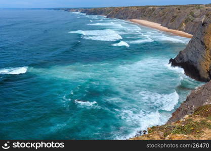 Summer Atlantic ocean coast landscape with sandy beach (Aljezur, Algarve, Portugal).