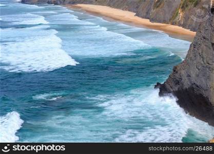 Summer Atlantic ocean coast landscape with sandy beach (Aljezur, Algarve, Portugal).