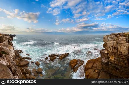 Summer Atlantic Ocean rocky coast sunset landscape in cloudy weather (Peniche, Portugal). Multi shots high-resolution panorama.