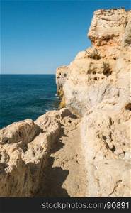 Summer Atlantic ocean rocky coastline near Carvoeiro town, Lagoa, Algarve - Portugal.