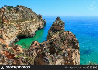 Summer Atlantic rocky coastline top view (Portimao, Alvor, Algarve, Portugal).