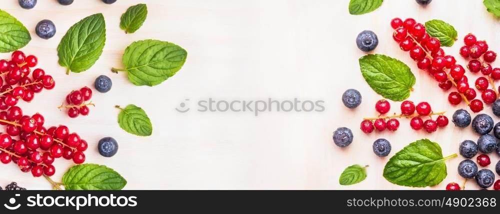 Summer berries on white wooden background top view, banner for website