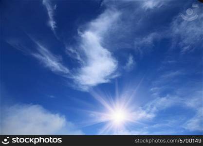 summer blue sky with sun and clouds