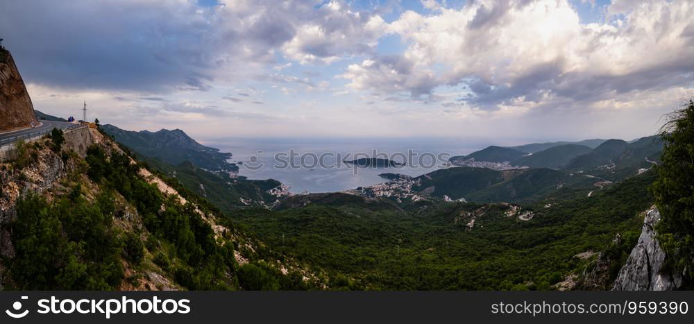 Summer Budva riviera coastline panorama landscape. Montenegro, Balkans, Adriatic sea, Europe. View from the top of the mountain road path.