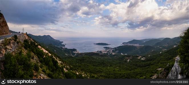Summer Budva riviera coastline panorama landscape. Montenegro, Balkans, Adriatic sea, Europe. View from the top of the mountain road path.