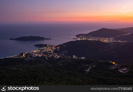 Summer Budva riviera night coastline panorama landscape. Montenegro, Balkans, Adriatic sea, Europe. View from the top of the mountain road path.