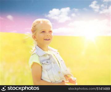 summer, childhood, leisure and people concept - happy little girl outdoors. happy little girl outdoors at summer