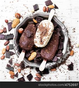 summer chocolate ice cream. tray with summer ice cream with chocolate filling and nuts