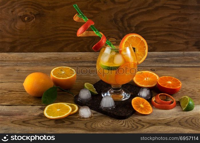 Summer citrus cocktail on wooden table. Fruit cocktail. Fruit drink. Citrus lemonade. Fruit lemonade. Summer drink . Summer citrus cocktail on wooden table