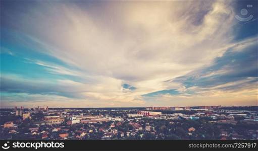 Summer city and sky clouds. Clear atmosphere. Summer city and sky clouds