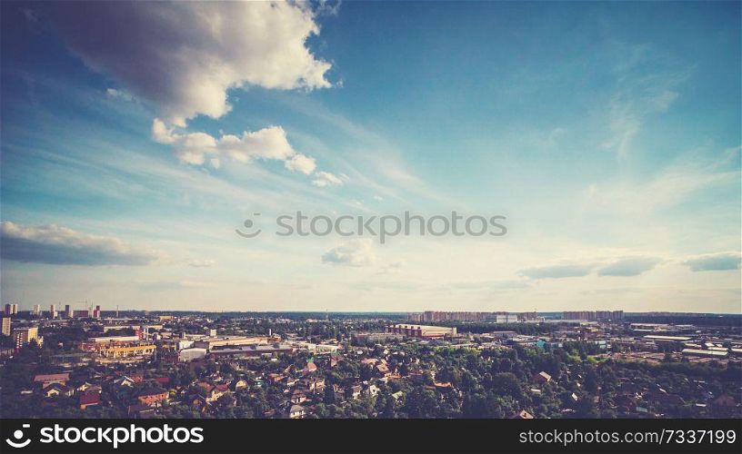 Summer city, colors sky and clouds. Nature background. Summer city, colors sky and clouds