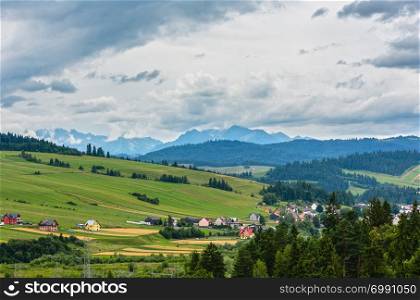 Summer cloudy country and Tatra mountain view from Czorsztyn village, Poland.