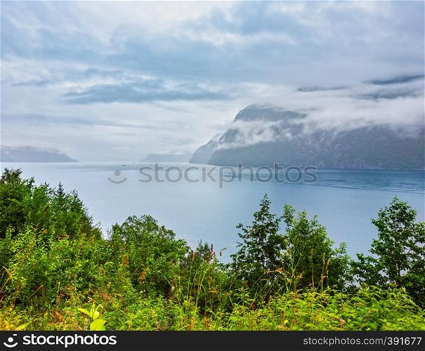 Summer cloudy evening fjord panorama view, Norway.