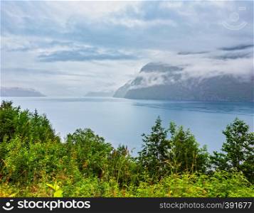 Summer cloudy evening fjord panorama view, Norway.