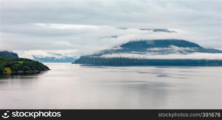 Summer cloudy evening fjord panorama view, Norway