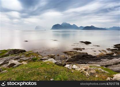 Summer cloudy Lofoten islands. Norway misty sea and fjords.