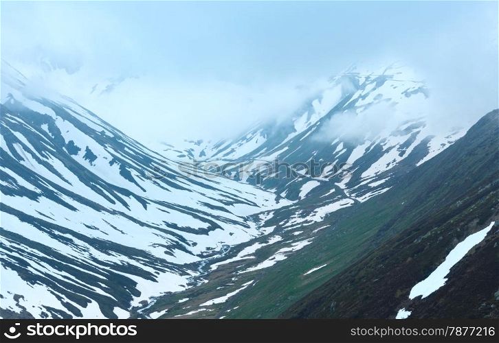 Summer cloudy mountain landscape (Oberalp Pass, Switzerland)