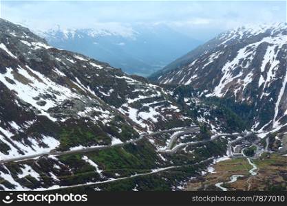 Summer cloudy mountain landscape with road (Furka Pass, Switzerland)