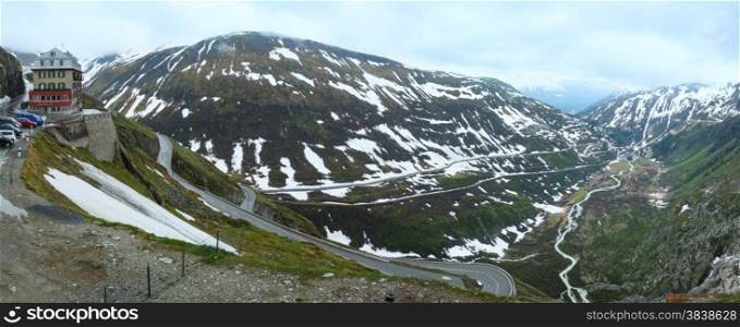 Summer cloudy mountain landscape with road (Furka Pass, Switzerland). Panorama.