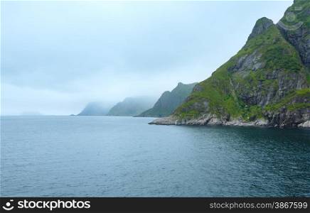 Summer cloudy sea coast view (Norway, Lofoten).