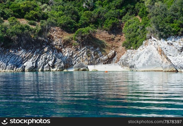 Summer coast view from motorboat with small beach (Kefalonia, not far from Agia Effimia, Greece)