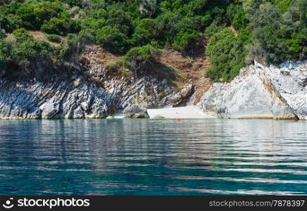 Summer coast view from motorboat with small beach (Kefalonia, not far from Agia Effimia, Greece)