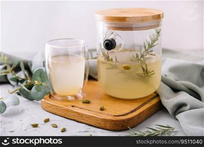 Summer cold tea and fresh herbs rosemary in glasses