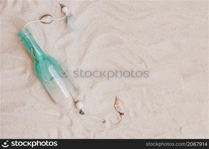 summer composition with sand bottle blank space