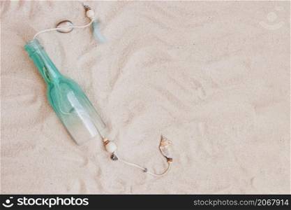 summer composition with sand bottle blank space