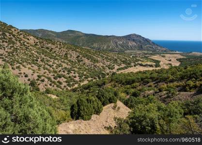 Summer Crimean landscape with mountains and the sea on a sunny day, Crimea.