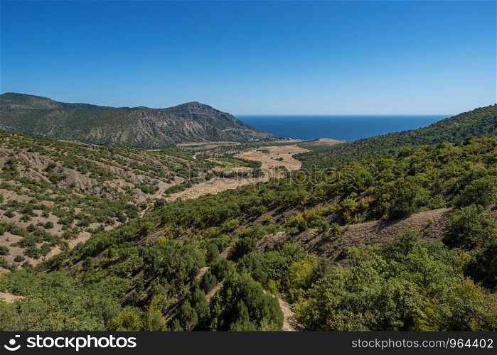 Summer Crimean landscape with mountains and the sea on a sunny day, Crimea.