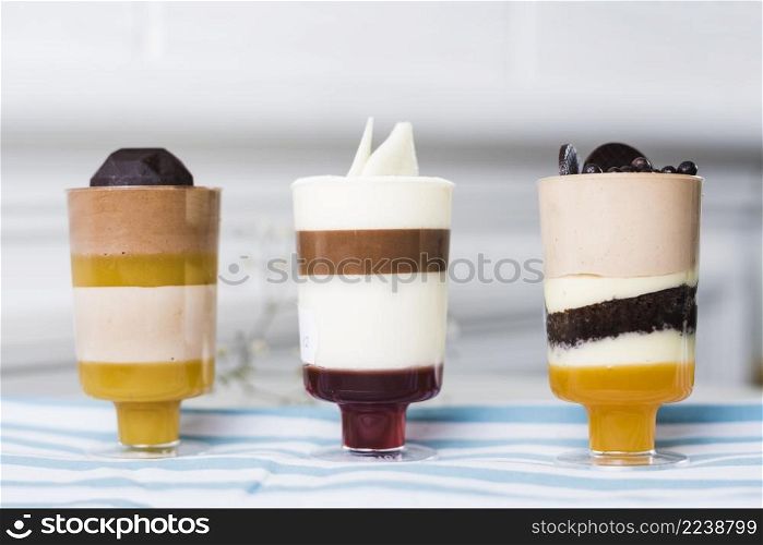 summer desserts glasses with chocolate toppings