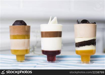 summer desserts glasses with chocolate toppings