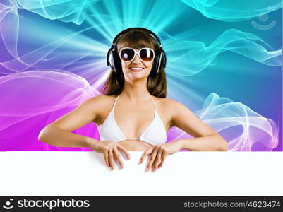 Summer disco party. Attractive girl in bikini with white blank banner