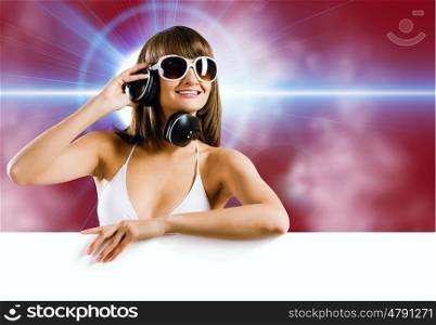 Summer disco party. Attractive girl in bikini with white blank banner